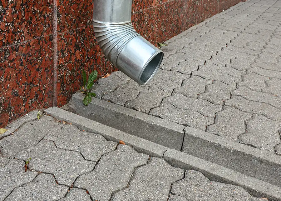 Concrete services, rain gutter, downspout to concrete rain gutter, directing water away from home, property - Collinsville, IL