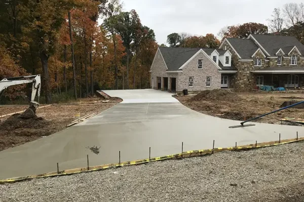 A+ Concrete - concrete flatwork services, finishing up long concrete driveway and sidewalk - Collinsville, IL