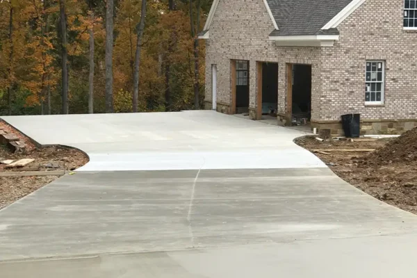 A+ Concrete - concrete flatwork services, finishing up long concrete driveway and sidewalk - Collinsville, IL