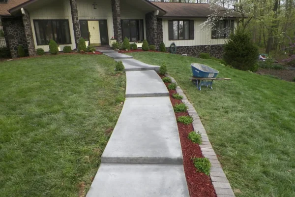 A+ Concrete - completed project, concrete path, steps leading up to nice home, landscaping and pavers bordering walkway - Collinsville, IL